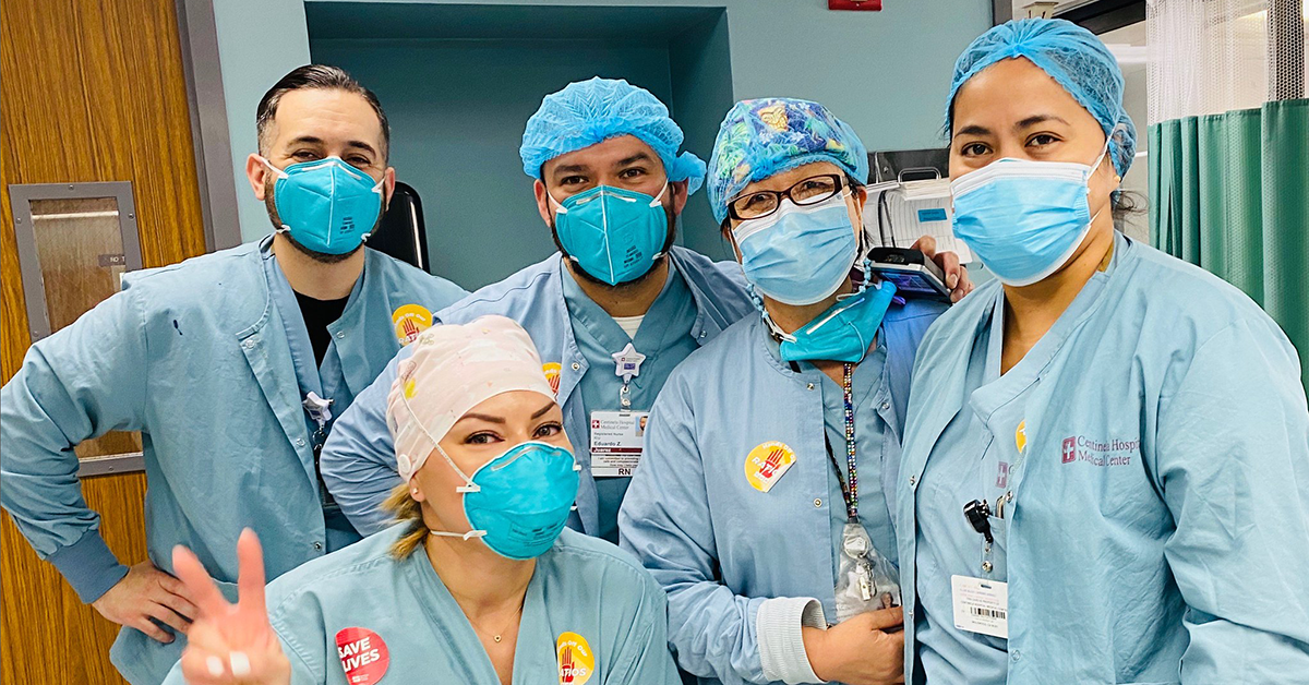 Group of masked nurses inside hospital