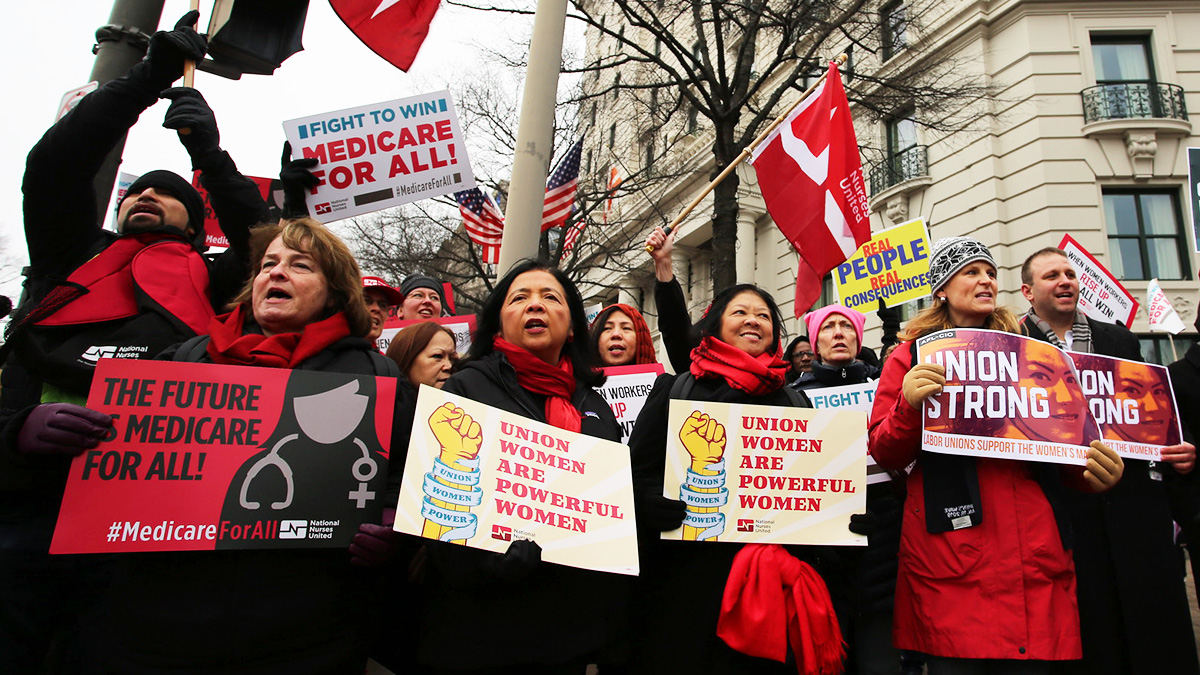 Nurses in Women's March hold signs "Union Women are Powerful Women"
