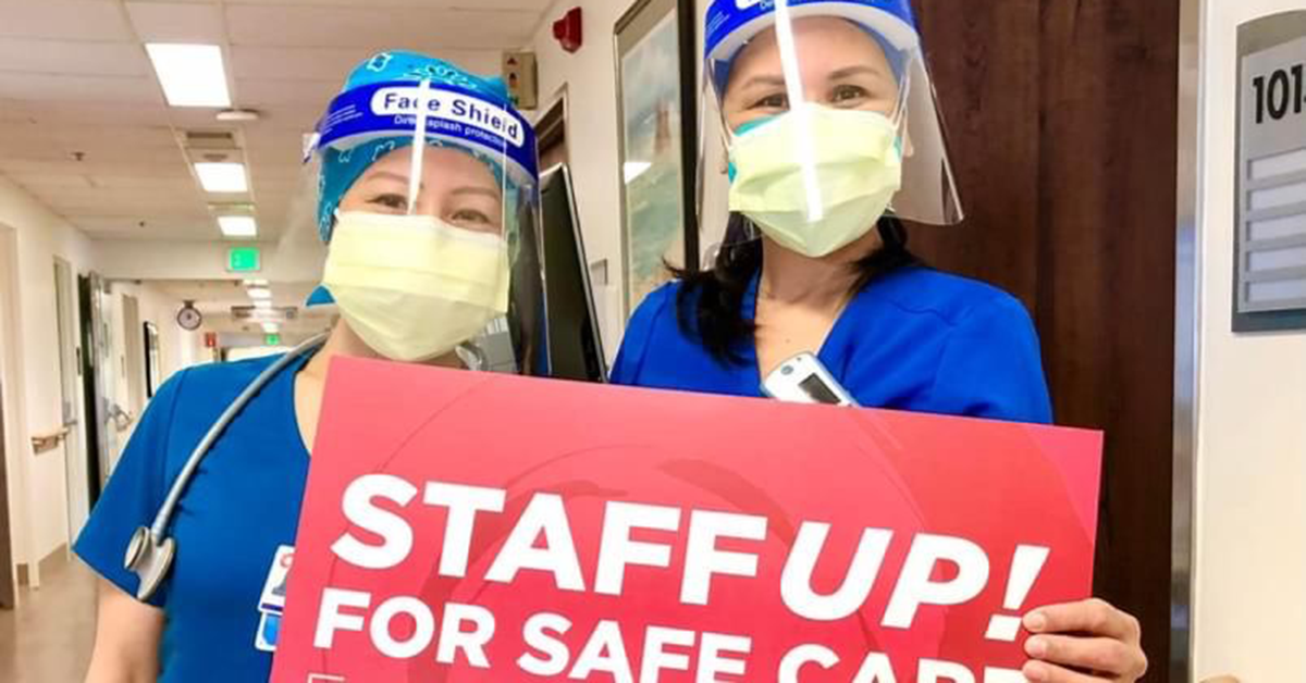 Two nurses holding sign: Staff up for safe care