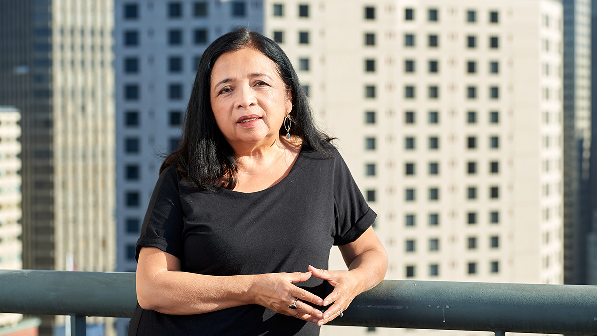 Bonnie Castillo, RN, standing on balcony