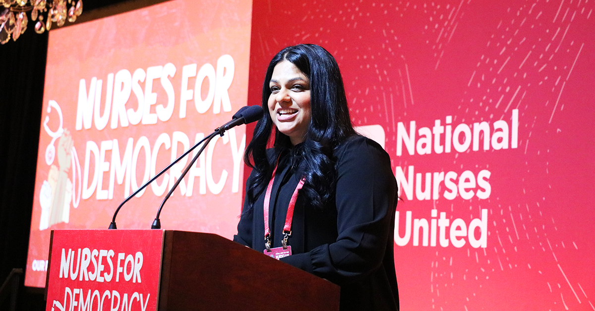 Executive Director Puneet Maharaj speaking at NNU Nurses for Democracy event