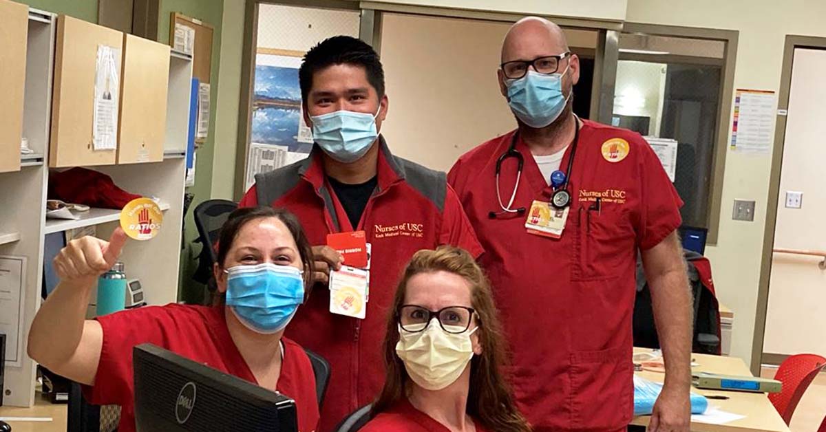 Four Keck nurses inside hospital wearing masks