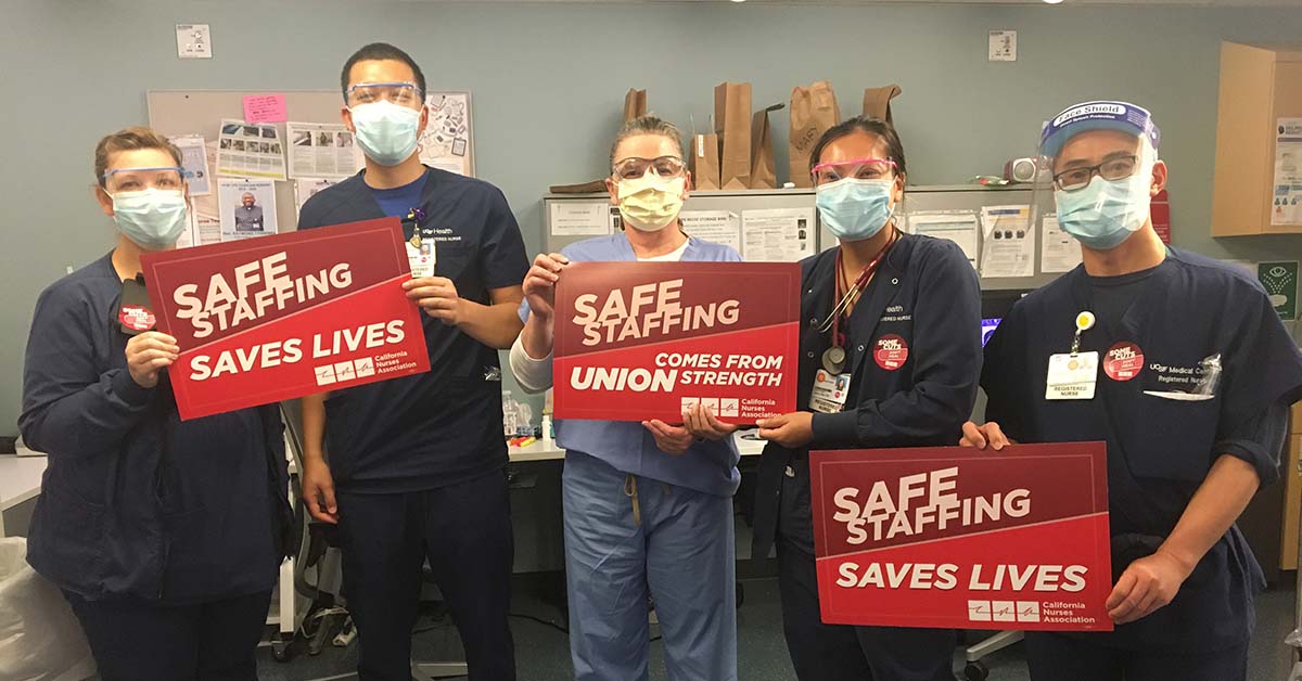 Nurse in hospital hold signs "Safe Staffing Saves Lives"
