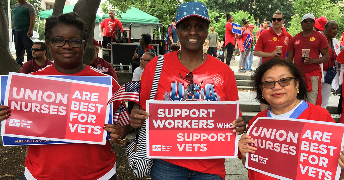 3 nurses hold signs "Support Workers who Support Vets"