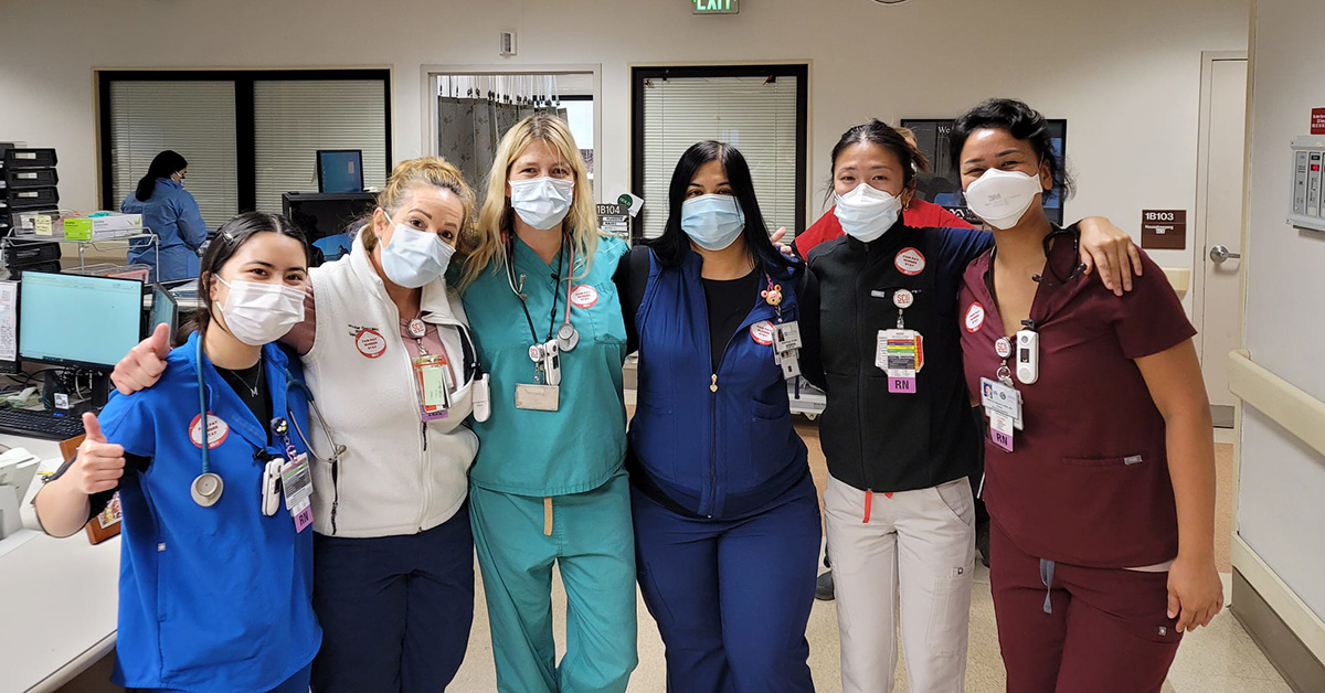 Group of nurses inside hospital smiling