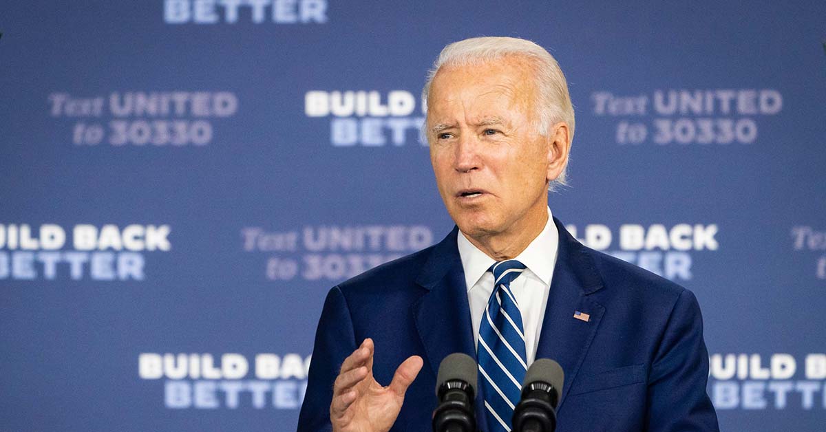 President Joe Biden in front of "Build Back Better" background