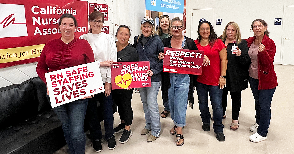 Hazel Hawkins RNs hold signs at town hall