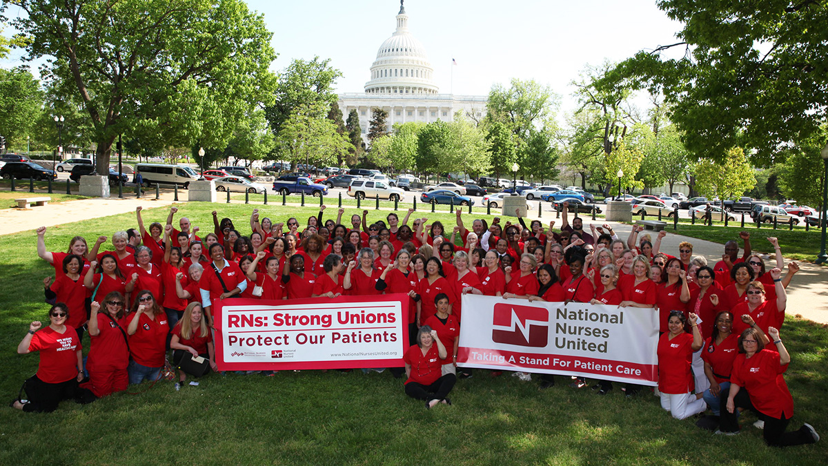 Large group of nurses outside Capitol building holding banner "Strong Unions Portect or Patients"