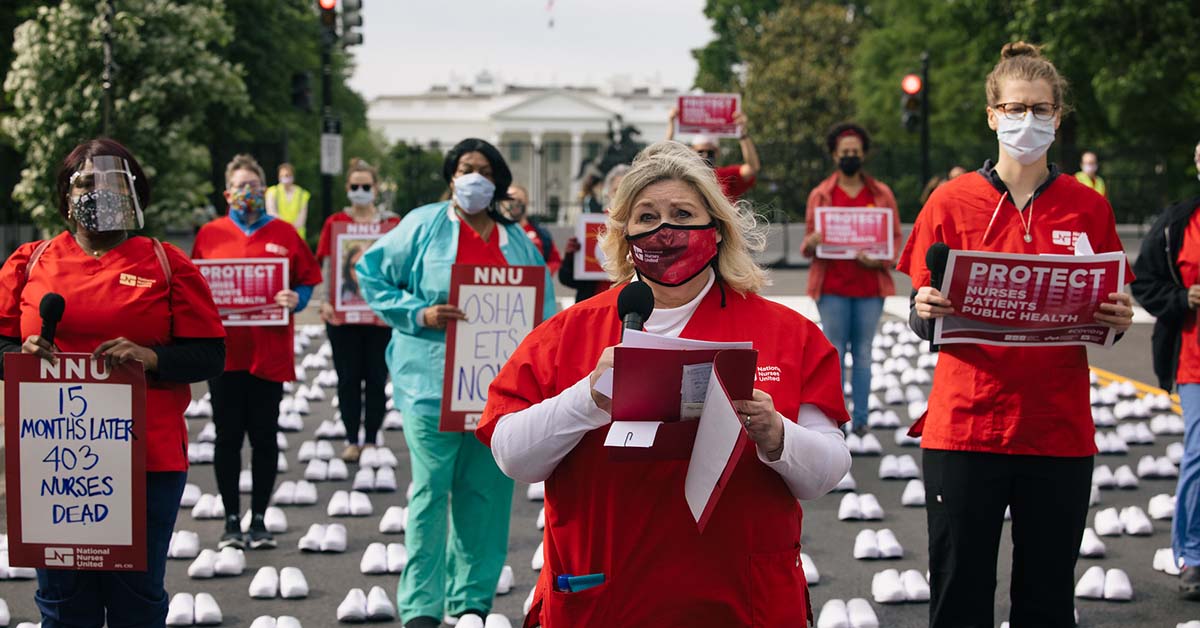 Nurses outside The White House holding signs calling for nurse, patient, and public safety