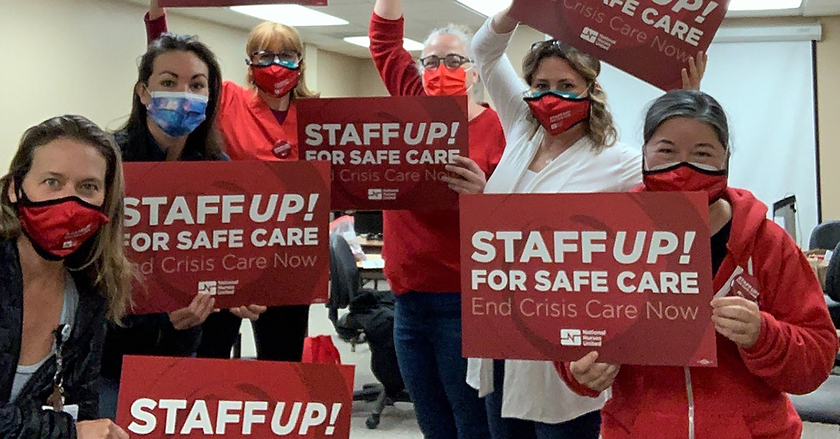 Watsonville nurses holding signs "Staff UP for safe care. End Crisis Care Now"