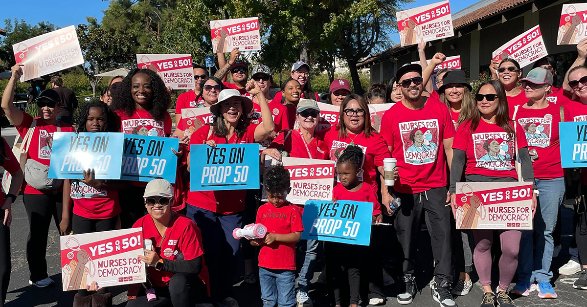 Nurses holding signs "Yes on 50: Nurses for Democracy"