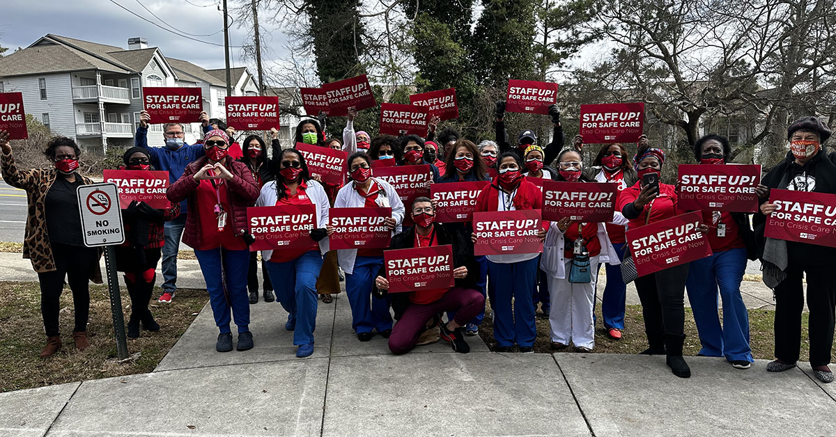 Atlanta VA Nurses holding up signs that say "Staff up for safe care!"