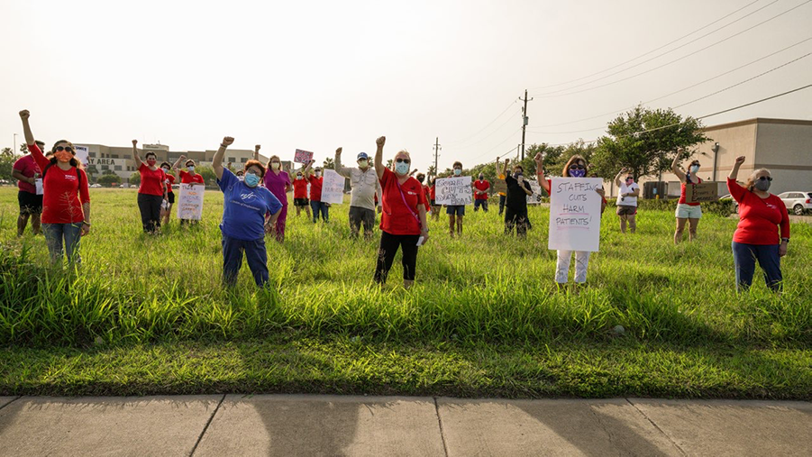 Nurses hold raised fists