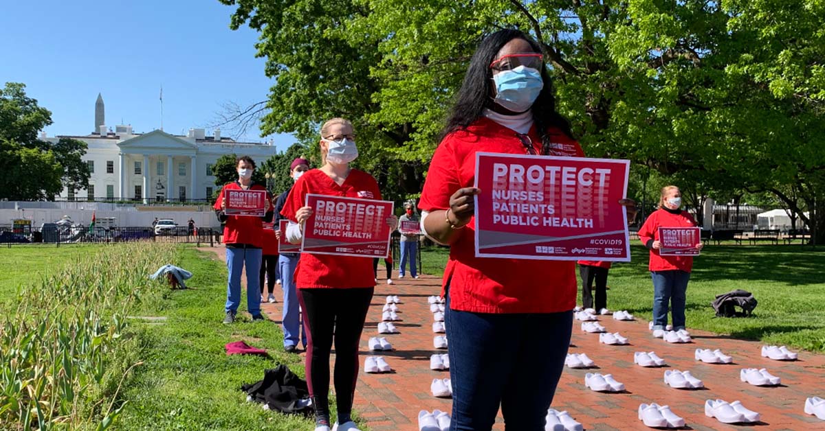 Nurses outside The White House holding signs calling for nurse, patient, and public safety