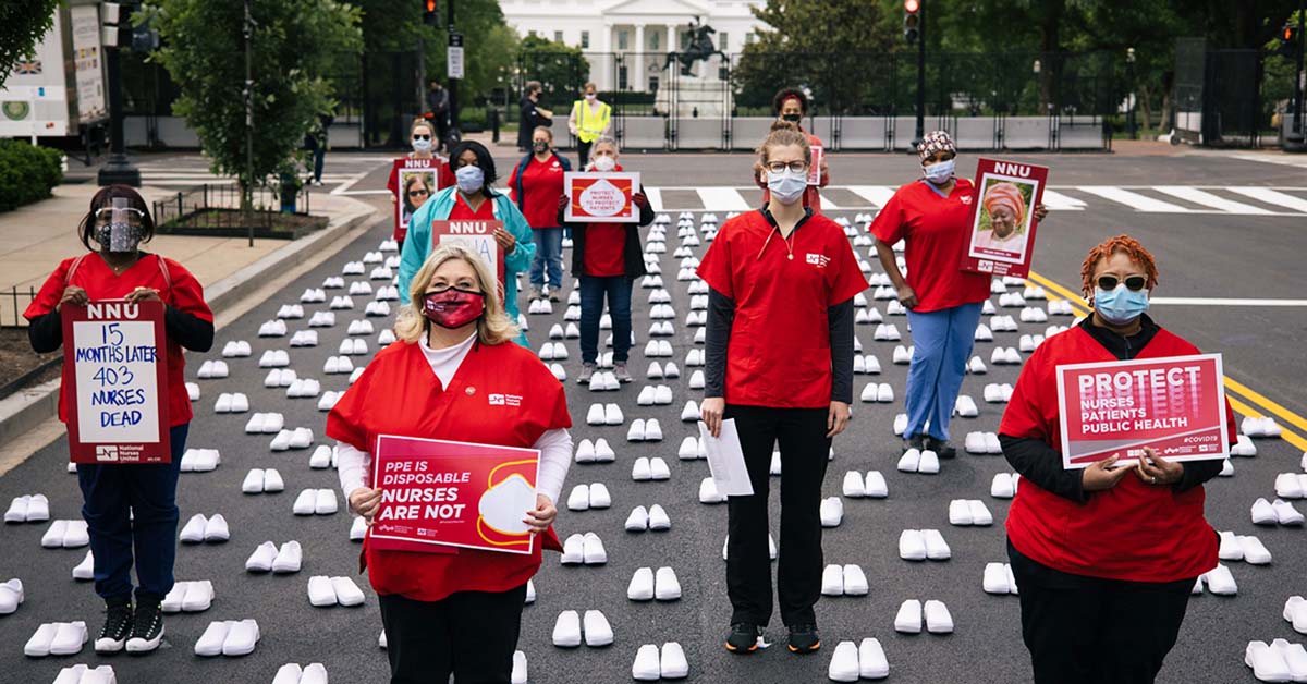 Nurses outside The White House holding signs calling for nurse, patient, and public safety