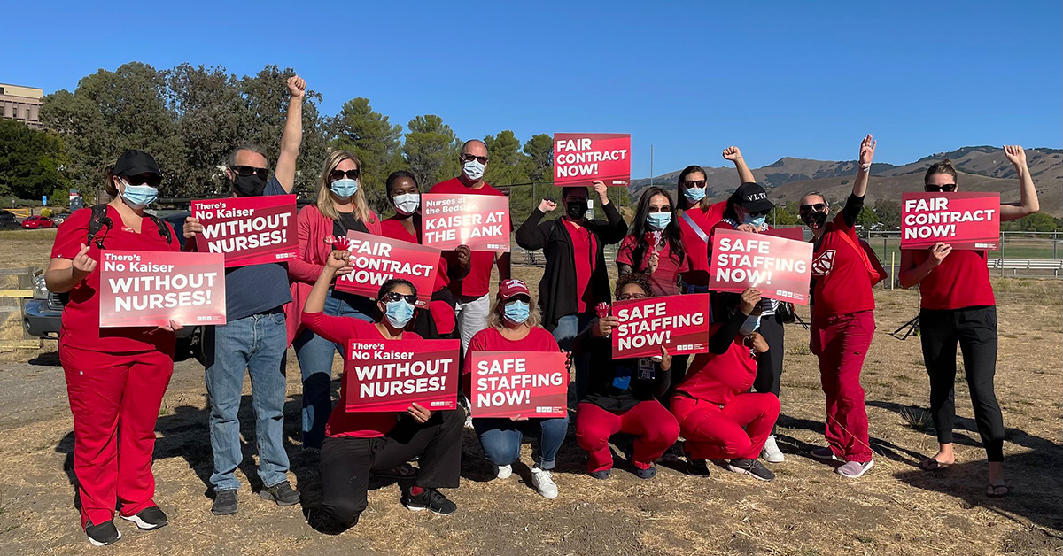 Group of nurses with raised fists