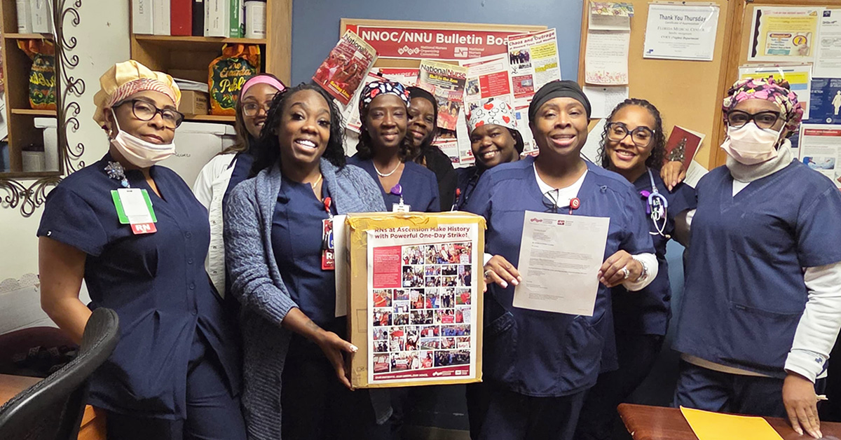 Nurses inside hospital holding letter