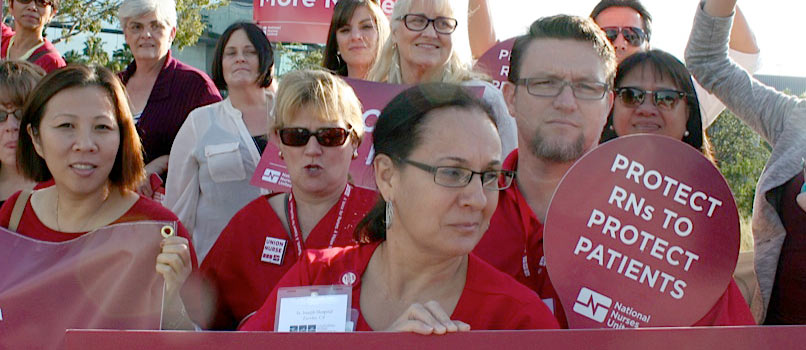 Nurses holding signs