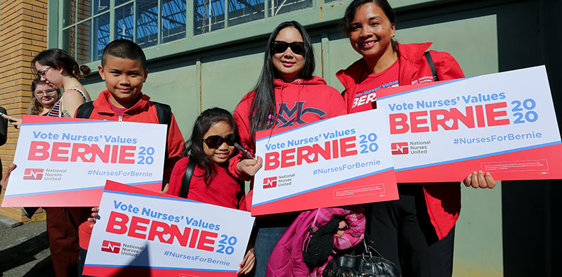 Nurses holding Vote Nurses' Values signs