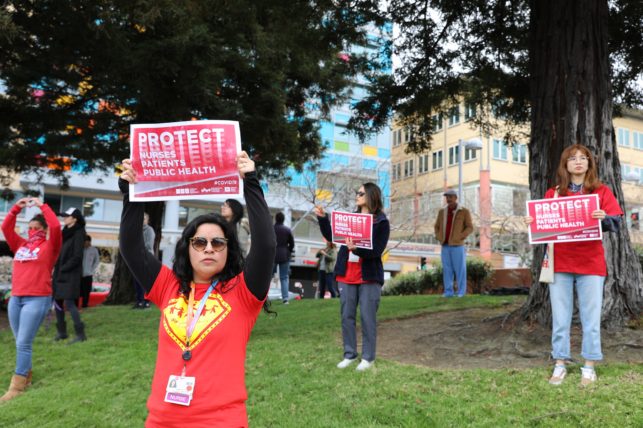 nurses holding signs