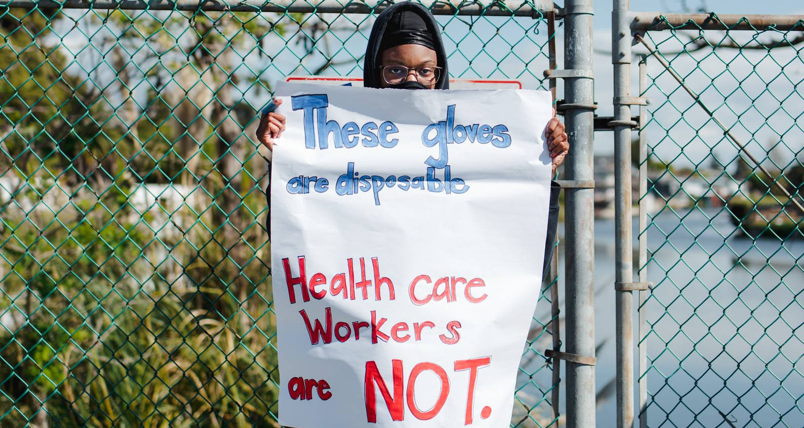 nurse holding sign