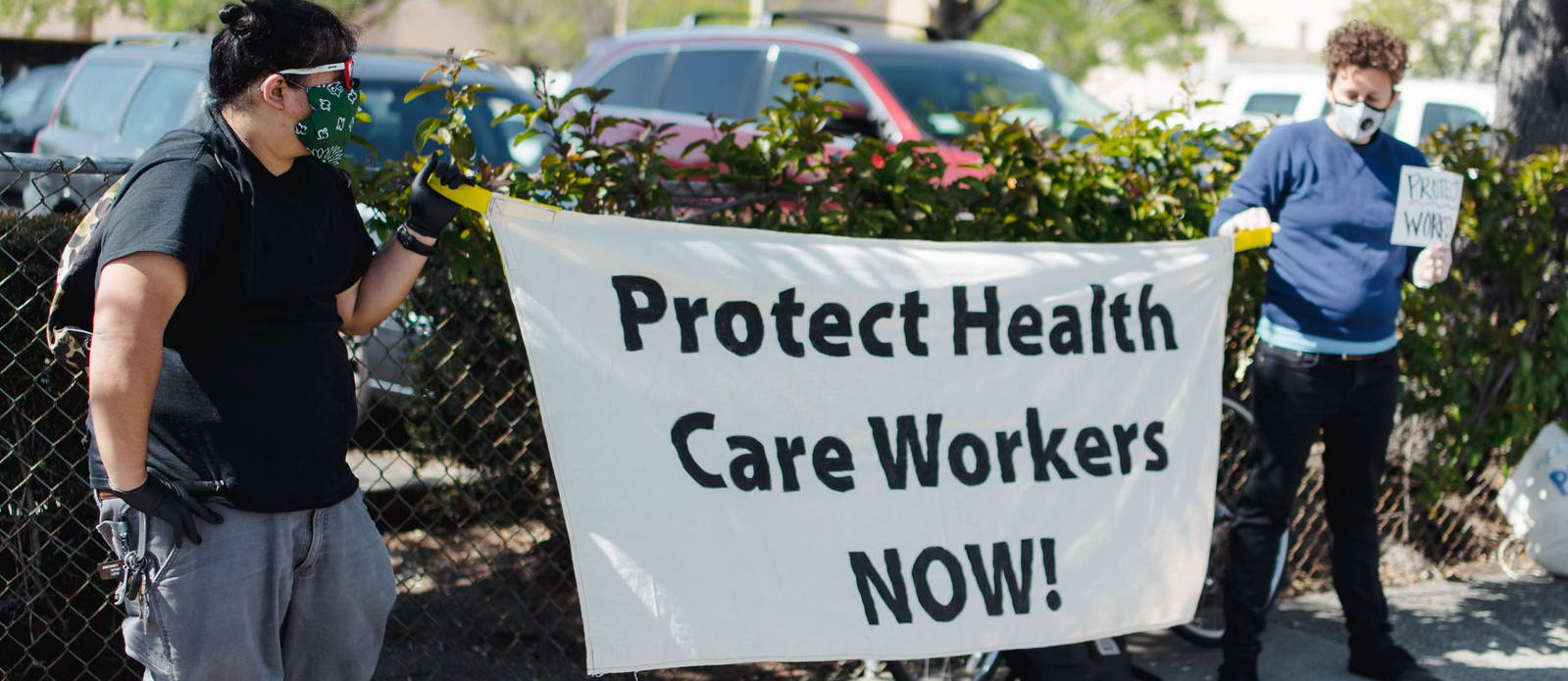 Workers with signs