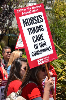 Nurse holding sign