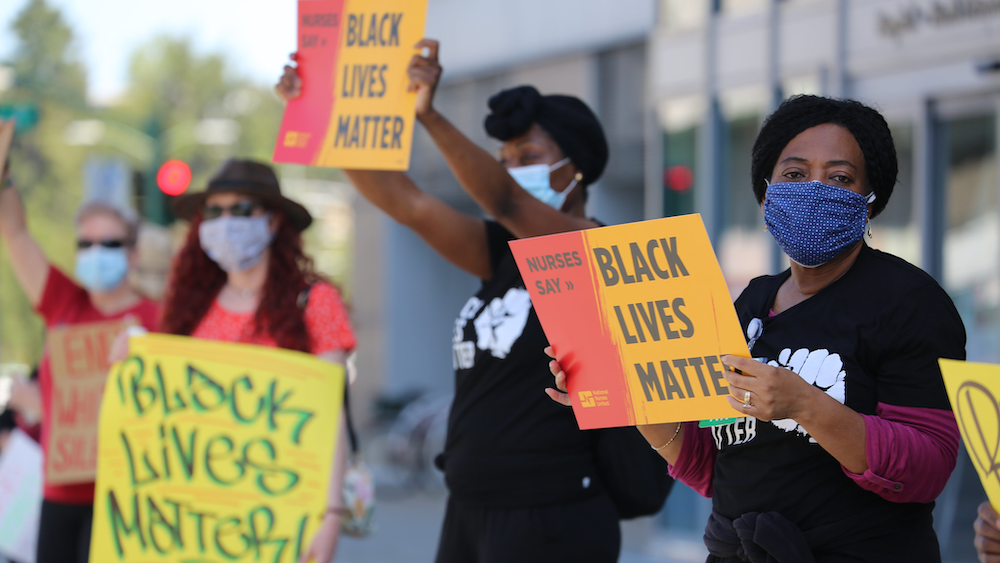 Nurses holding signs "Black Lives Matter"