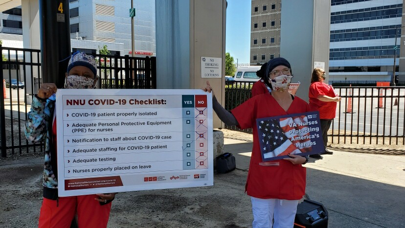 VA Nurses holding signs