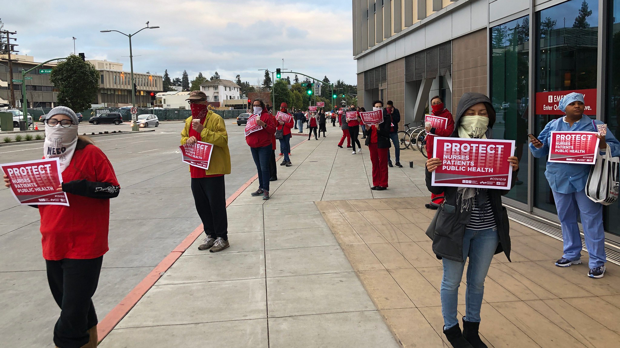 Nurses holding signs outside Enloe Medical Center