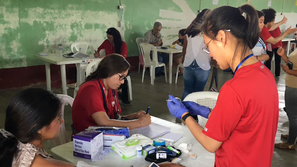 Nurses tend to patient in Guatemala