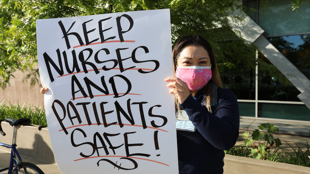 nurse holding sign