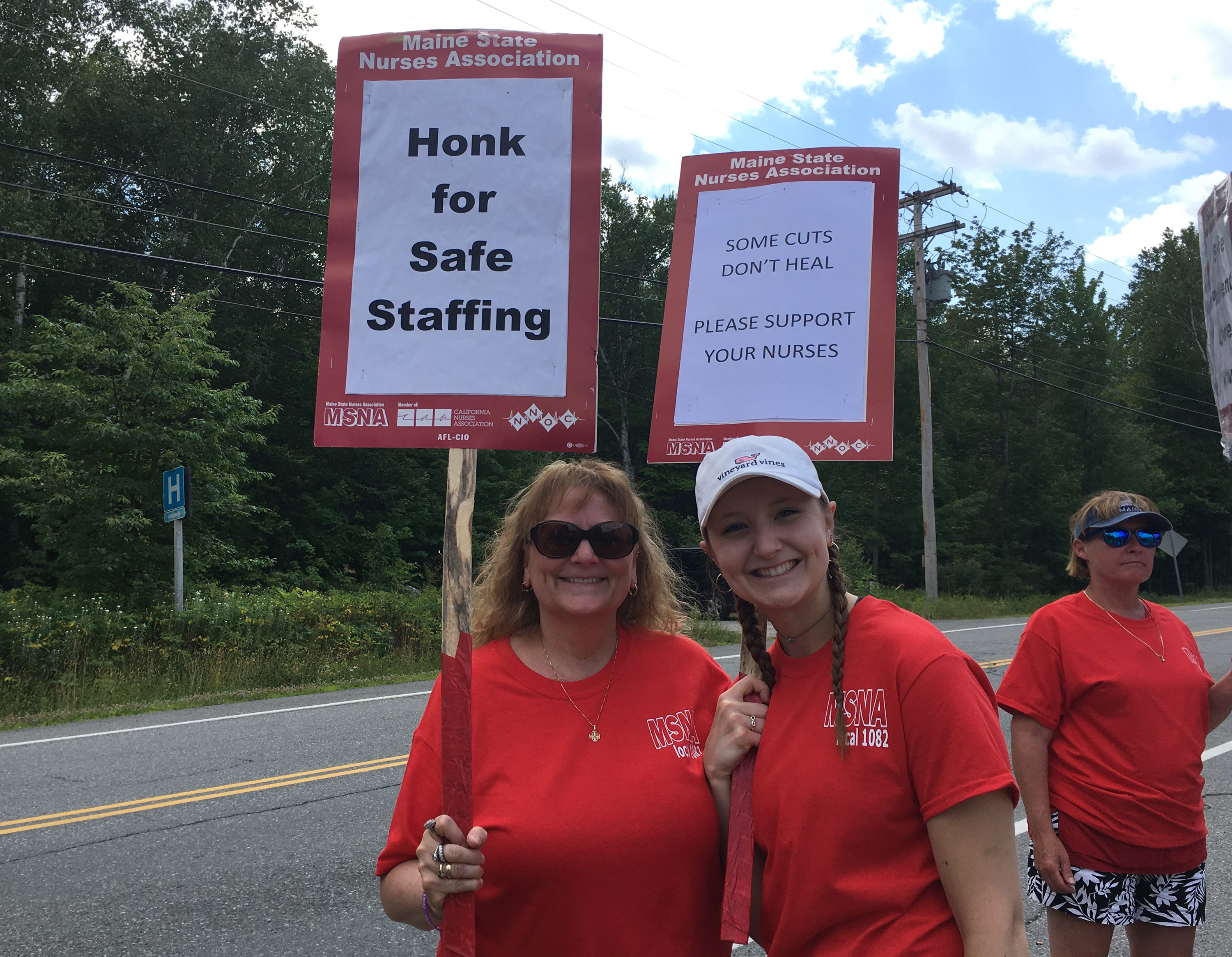 MSNA nurses holding signs for safe staffing