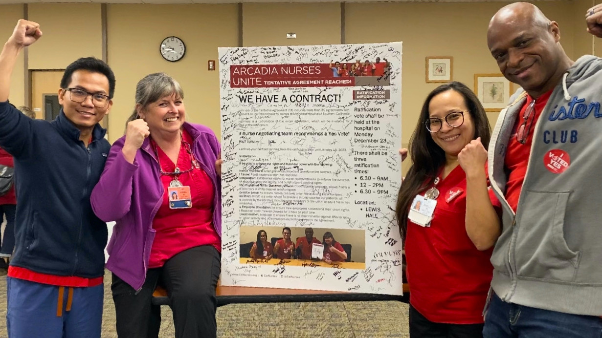 Nurses pose with new contract