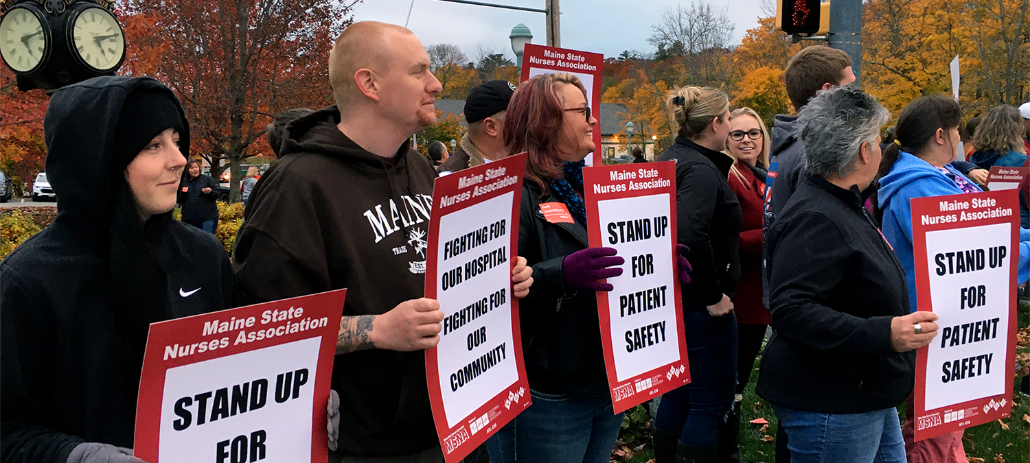 Nurses from Northern Light Hospital in Maine hold signs for patient safety