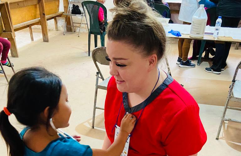 RNRN volunteer with young girle