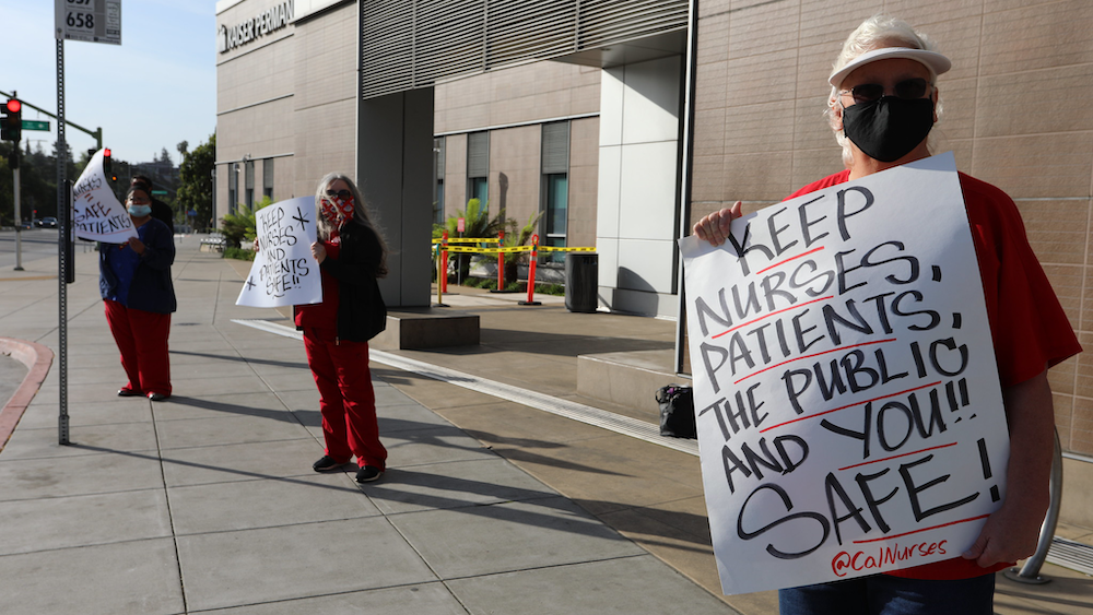 Nurses holding signs promoting public safety