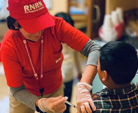 Nurse volunteering with RNRN