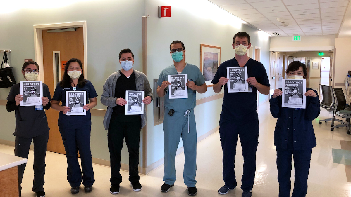 UCI nurses hold "Protect Nurses" signs