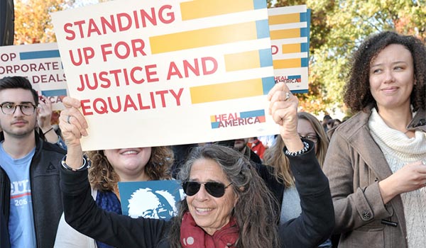 woman holding equality sign