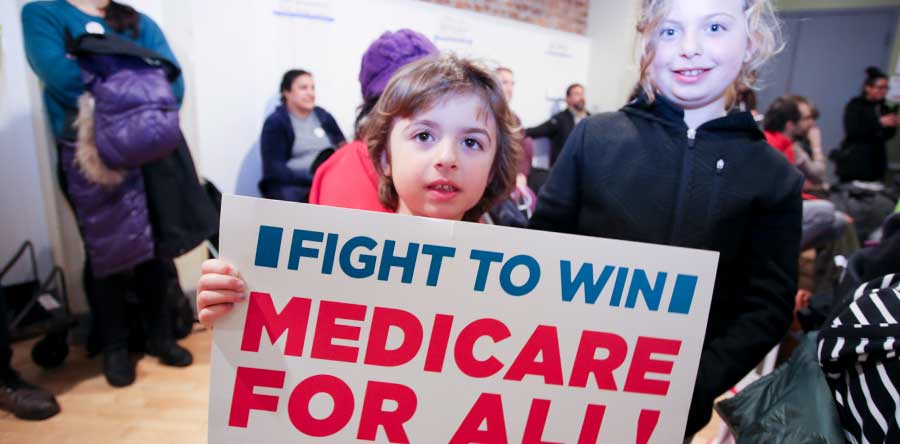 Girl holding medicare for all sign