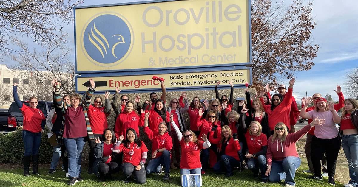 Oroville nurses pose at action in front of Oroville Hospital