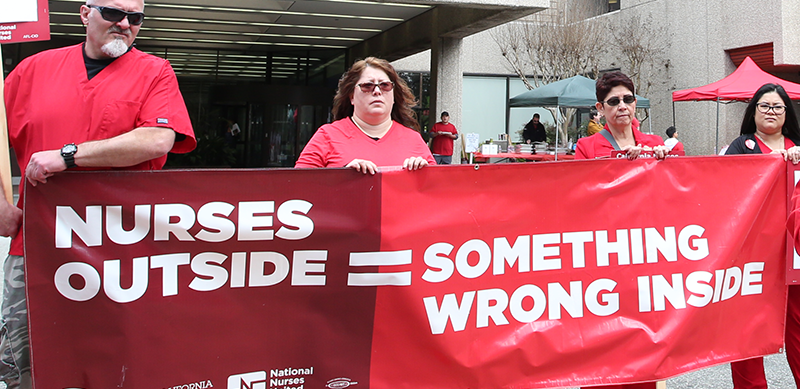 Nurses with banner