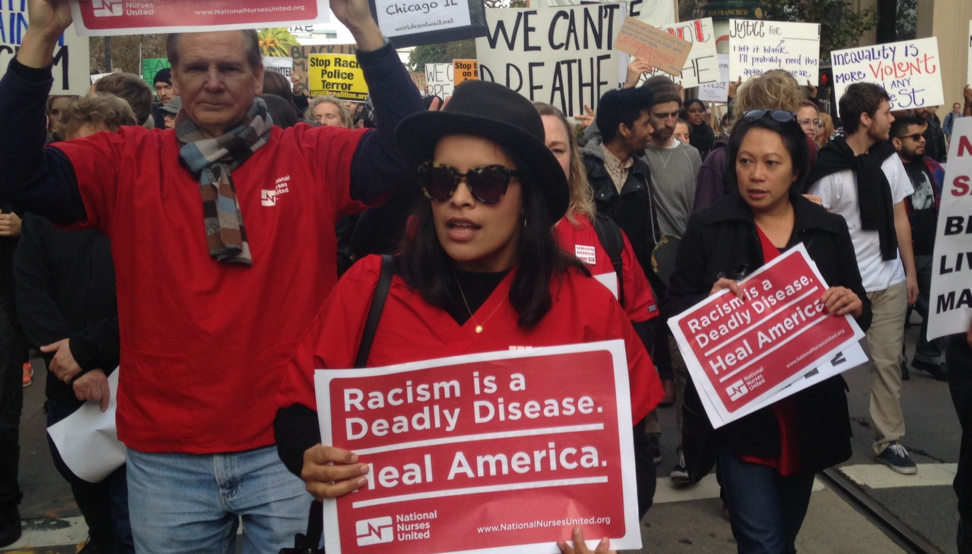 nurses holding signs