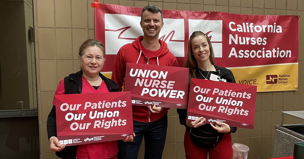 UCSD nurses hold signs in support of union rights and patient safety.