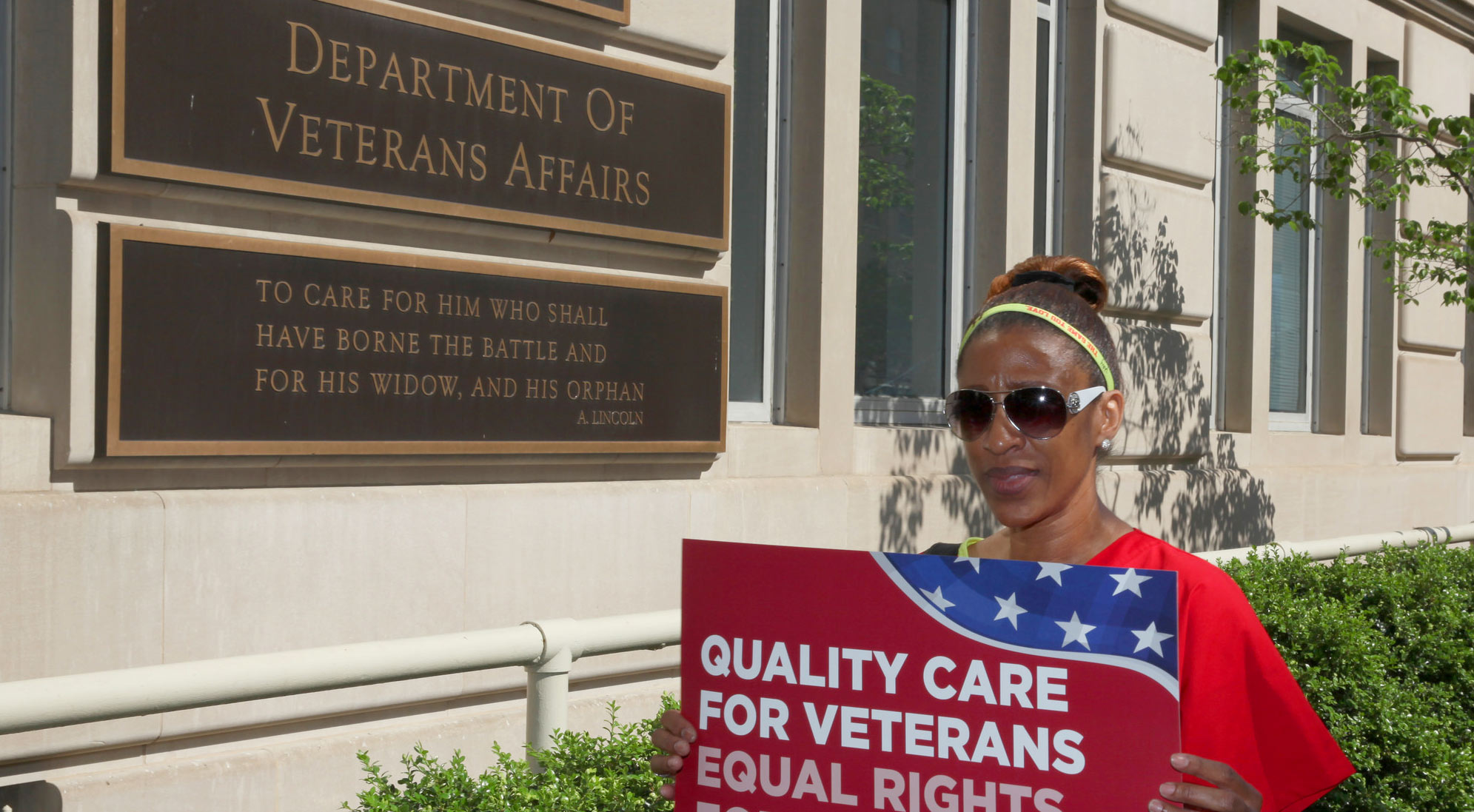 RN holding sign