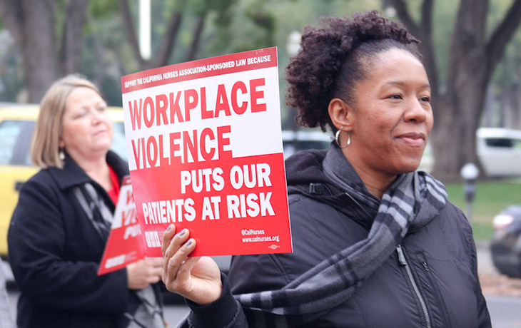 Nurses with Workplace Violence signs