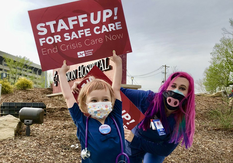 Kira Farrington, RN and her daughter protesting short staffing outside HCA’s Mission Hospital in April 2022.