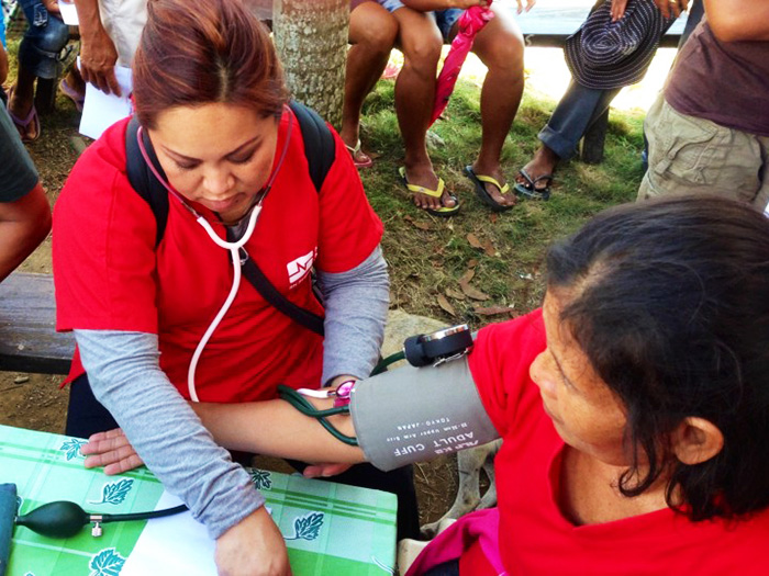 Michelle Vo, RN, providing care to a patient in the Philippines