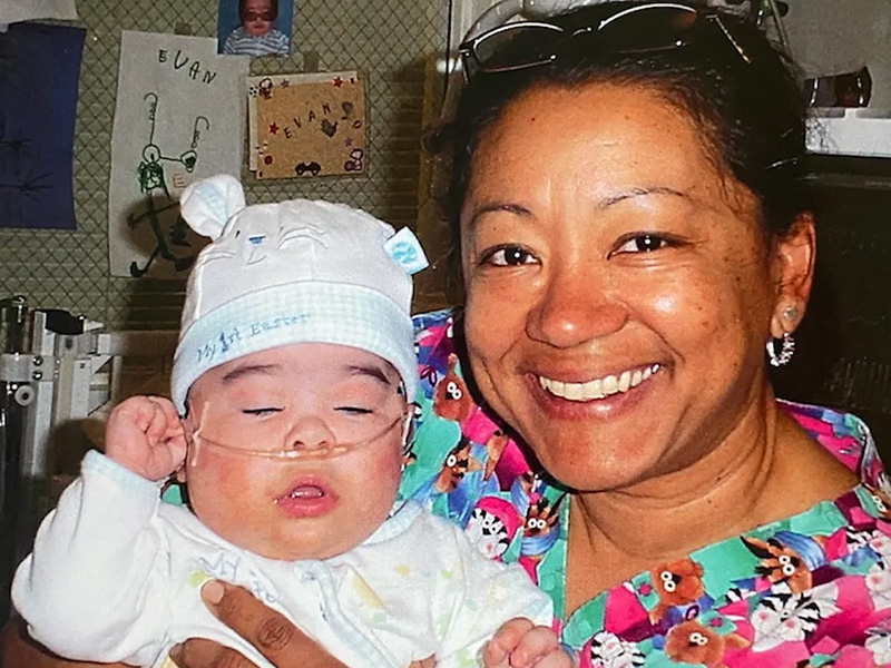 Cathy Kennedy, RN and President of CNA with a young patient